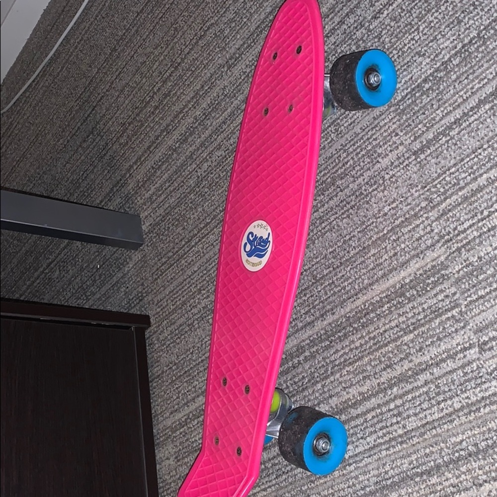 pink and blue penny board